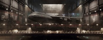 Movie still from “The Wandering Earth” (2019), directed by Frant Gwo – An airplane is in a hangar at night time; Extreme Wide shot, Low angle