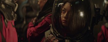 Movie still from “The Wandering Earth” (2019), directed by Frant Gwo – A woman wearing a space suit and a helmet; Close Up shot, Over the shoulder angle