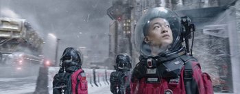 Movie still from “The Wandering Earth” (2019), directed by Frant Gwo – A group of people in spacesuits on a snowy day; Medium shot, Low angle