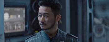 Movie still from “The Wandering Earth” (2019), directed by Frant Gwo – A person wearing a jacket; Close Up shot, Over the shoulder angle