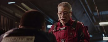 Movie still from “The Wandering Earth” (2019), directed by Frant Gwo – An older man in a red jacket talking to a younger man; Close Up shot, Over the shoulder angle