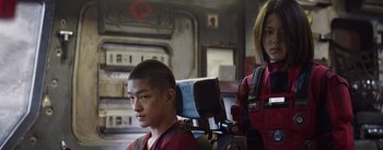 Movie still from “The Wandering Earth” (2019), directed by Frant Gwo – A man and a woman in a room; Medium shot, Low angle
