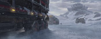 Movie still from “The Wandering Earth” (2019), directed by Frant Gwo – A group of vehicles driving on a snow covered road; Extreme Wide shot, Low angle