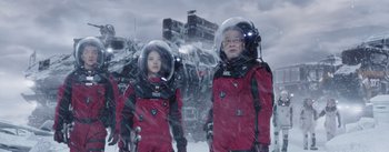 Movie still from “The Wandering Earth” (2019), directed by Frant Gwo – A man and a woman in space suits standing next to each other; Wide shot, Low angle