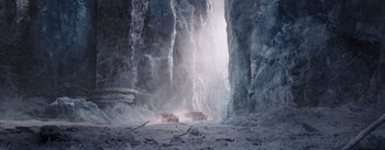 Movie still from “The Wandering Earth” (2019), directed by Frant Gwo – A car is driving through a snow - covered mountain; Extreme Wide shot, Low angle