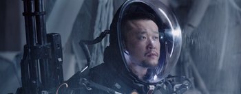 Movie still from “The Wandering Earth” (2019), directed by Frant Gwo – A man in a space suit is looking at the camera; Close Up shot, Low angle