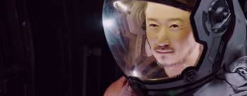 Movie still from “The Wandering Earth” (2019), directed by Frant Gwo – A man wearing a helmet with a helmet on his head; Close Up shot, High angle
