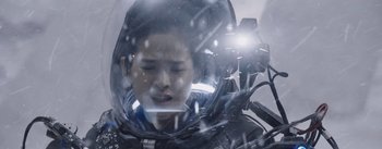Movie still from “The Wandering Earth” (2019), directed by Frant Gwo – A young man in a space suit is looking at the camera; Close Up shot, Low angle