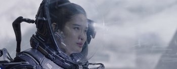 Movie still from “The Wandering Earth” (2019), directed by Frant Gwo – A woman in a space suit looking out of a window; Close Up shot, Over the shoulder angle