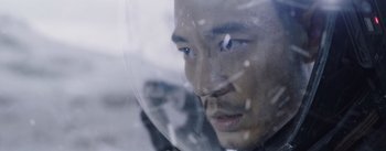 Movie still from “The Wandering Earth” (2019), directed by Frant Gwo – A man's face through a window; Close Up shot, Over the shoulder angle