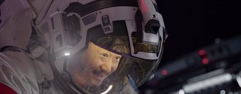 Movie still from “The Wandering Earth” (2019), directed by Frant Gwo – A person wearing a helmet; Close Up shot, Over the shoulder angle