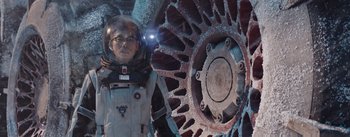 Movie still from “The Wandering Earth” (2019), directed by Frant Gwo – A man in a spacesuit standing in front of an object; Medium shot, Low angle