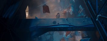 Movie still from “The Wandering Earth” (2019), directed by Frant Gwo – An overhead view of a woman looking up at clothes hanging; Extreme Wide shot, Overhead angle