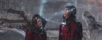 Movie still from “The Wandering Earth” (2019), directed by Frant Gwo – A couple of people in spacesuits and helmets; Medium shot, Low angle