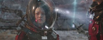 Movie still from “The Wandering Earth” (2019), directed by Frant Gwo – A woman wearing a space suit and a helmet; Close Up shot, Low angle