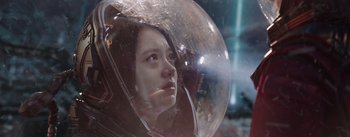 Movie still from “The Wandering Earth” (2019), directed by Frant Gwo – A girl in a space helmet looking into the distance; Close Up shot, Low angle