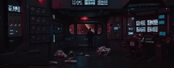 Movie still from “The Wandering Earth” (2019), directed by Frant Gwo – A man standing in front of a window in a dark room; Extreme Wide shot, High angle