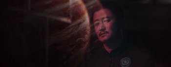 Movie still from “The Wandering Earth” (2019), directed by Frant Gwo – A man with a black shirt is looking at the camera; Close Up shot, Low angle