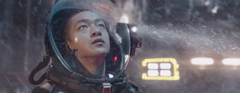 Movie still from “The Wandering Earth” (2019), directed by Frant Gwo – A man in a space suit looking up at the sky; Close Up shot, Low angle