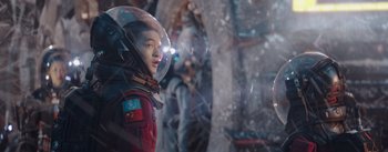 Movie still from “The Wandering Earth” (2019), directed by Frant Gwo – A person in a space suit with a helmet on; Medium shot, Over the shoulder angle
