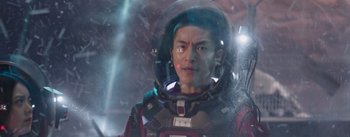 Movie still from “The Wandering Earth” (2019), directed by Frant Gwo – A man in a space suit is looking at the camera; Medium shot, Low angle