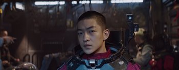 Movie still from “The Wandering Earth” (2019), directed by Frant Gwo – A man in a space suit is looking at the camera; Close Up shot, Over the shoulder angle