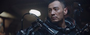 Movie still from “The Wandering Earth” (2019), directed by Frant Gwo – A person holding a gun; Close Up shot, Low angle