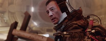 Movie still from “The Wandering Earth” (2019), directed by Frant Gwo – A person wearing a helmet; Close Up shot, Low angle