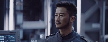 Movie still from “The Wandering Earth” (2019), directed by Frant Gwo – A person wearing a jacket; Close Up shot, Over the shoulder angle