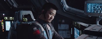 Movie still from “The Wandering Earth” (2019), directed by Frant Gwo – A man with a headset sitting in a room; Close Up shot, Over the shoulder angle