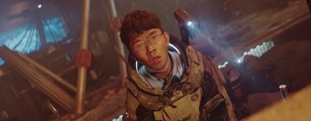 Movie still from “The Wandering Earth” (2019), directed by Frant Gwo – A man in a space suit with a flashlight; Medium shot, Low angle