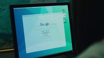 Movie still from “Cam” (2018), directed by Daniel Goldhaber – A computer screen showing a google library page on it; Extreme Close Up shot, High angle