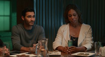 Movie still from “Can You Keep a Secret?” (2019), directed by Elise Durán – A man and a woman sitting at a dinner table; Medium shot, Over the shoulder angle