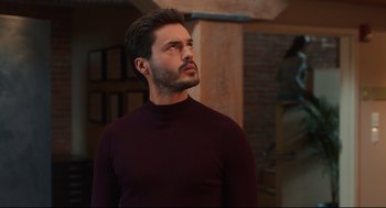 Movie still from “Can You Keep a Secret?” (2019), directed by Elise Durán – A person wearing a sweater; Close Up shot, Low angle