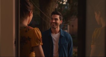 Movie still from “Can You Keep a Secret?” (2019), directed by Elise Durán – A man and a woman are talking to each other; Medium shot, Over the shoulder angle