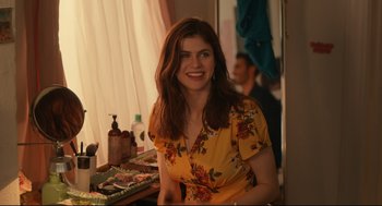 Movie still from “Can You Keep a Secret?” (2019), directed by Elise Durán – A woman sitting in front of a mirror in a room; Medium shot, Over the shoulder angle