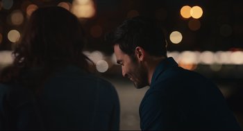 Movie still from “Can You Keep a Secret?” (2019), directed by Elise Durán – A person with his face close to the ground; Close Up shot, Over the shoulder angle