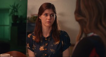 Movie still from “Can You Keep a Secret?” (2019), directed by Elise Durán – A woman in a blue shirt is looking at the camera; Close Up shot, Over the shoulder angle