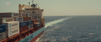 Movie still from “Captain Phillips” (2013), directed by Paul Greengrass – A large cargo ship sailing in the middle of the ocean; Extreme Wide shot, High angle