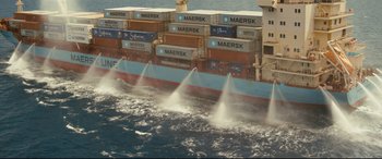 Movie still from “Captain Phillips” (2013), directed by Paul Greengrass – A large cargo ship is in the water; Extreme Wide shot, Low angle