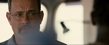 Movie still from “Captain Phillips” (2013), directed by Paul Greengrass – A man's face in a car; Close Up shot, Over the shoulder angle