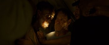 Movie still from “Captain Phillips” (2013), directed by Paul Greengrass – Two men are looking at each other in the dark; Close Up shot, Over the shoulder angle