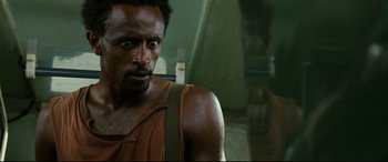 Movie still from “Captain Phillips” (2013), directed by Paul Greengrass – A person with a beard; Close Up shot, Over the shoulder angle