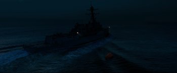 Movie still from “Captain Phillips” (2013), directed by Paul Greengrass – A boat in the ocean at night with lights on; Extreme Wide shot, High angle