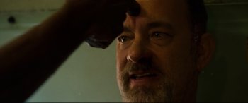 Movie still from “Captain Phillips” (2013), directed by Paul Greengrass – A man's face with one eye open; Extreme Close Up shot, Low angle