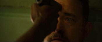 Movie still from “Captain Phillips” (2013), directed by Paul Greengrass – A man with a beard looking into the distance; Extreme Close Up shot, Low angle