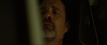 Movie still from “Captain Phillips” (2013), directed by Paul Greengrass – A person with a beard; Close Up shot, Overhead angle