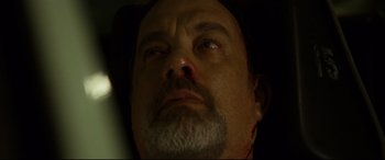 Movie still from “Captain Phillips” (2013), directed by Paul Greengrass – A man with a beard; Close Up shot, Overhead angle