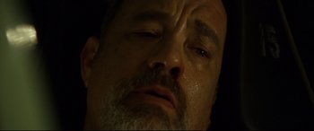 Movie still from “Captain Phillips” (2013), directed by Paul Greengrass – A man's face as he sleeps; Extreme Close Up shot, Overhead angle