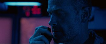 Movie still from “Captain Phillips” (2013), directed by Paul Greengrass – A person talking on a cell phone; Close Up shot, Low angle